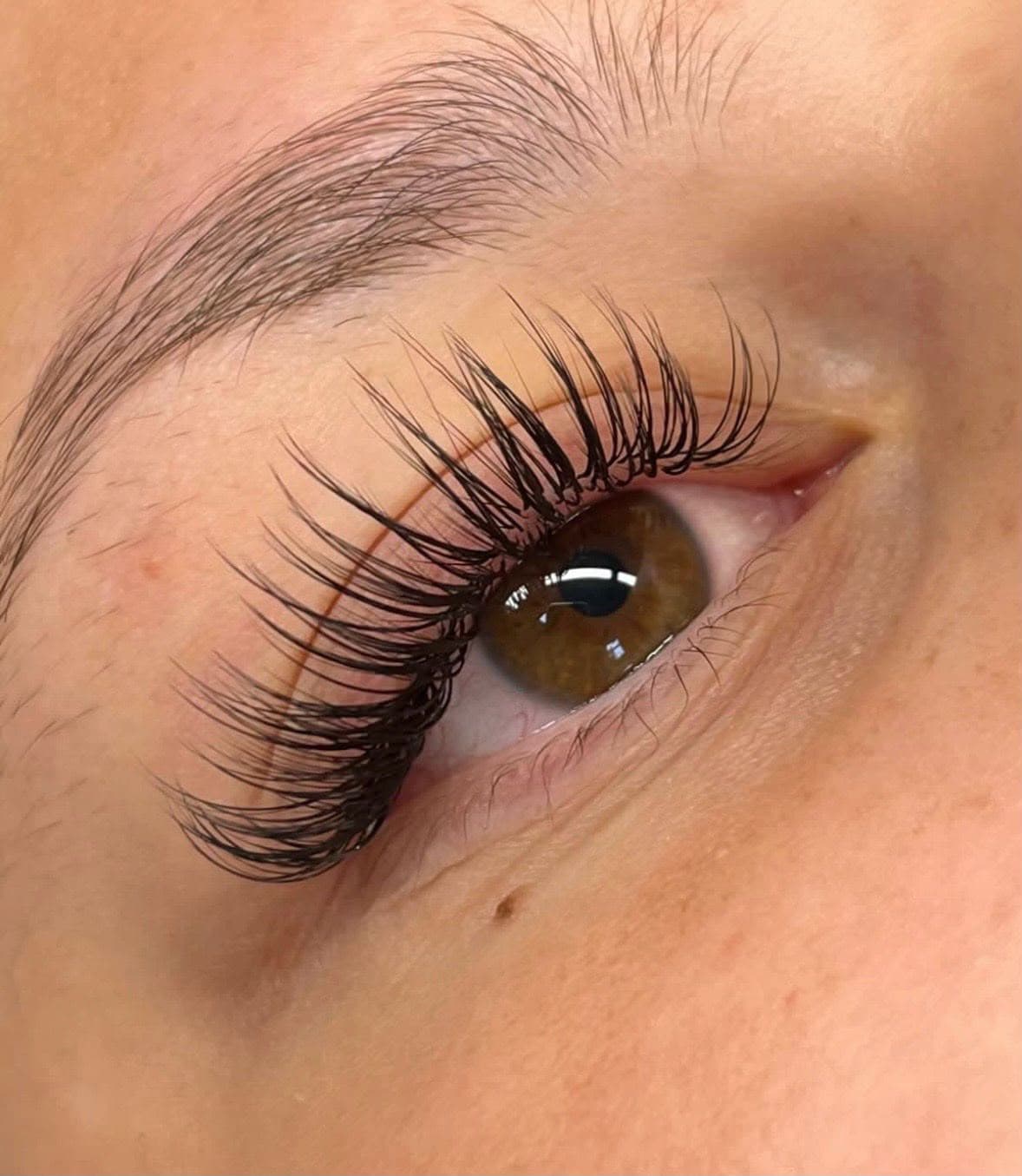 Detailed close-up of a classic eyelash extension set