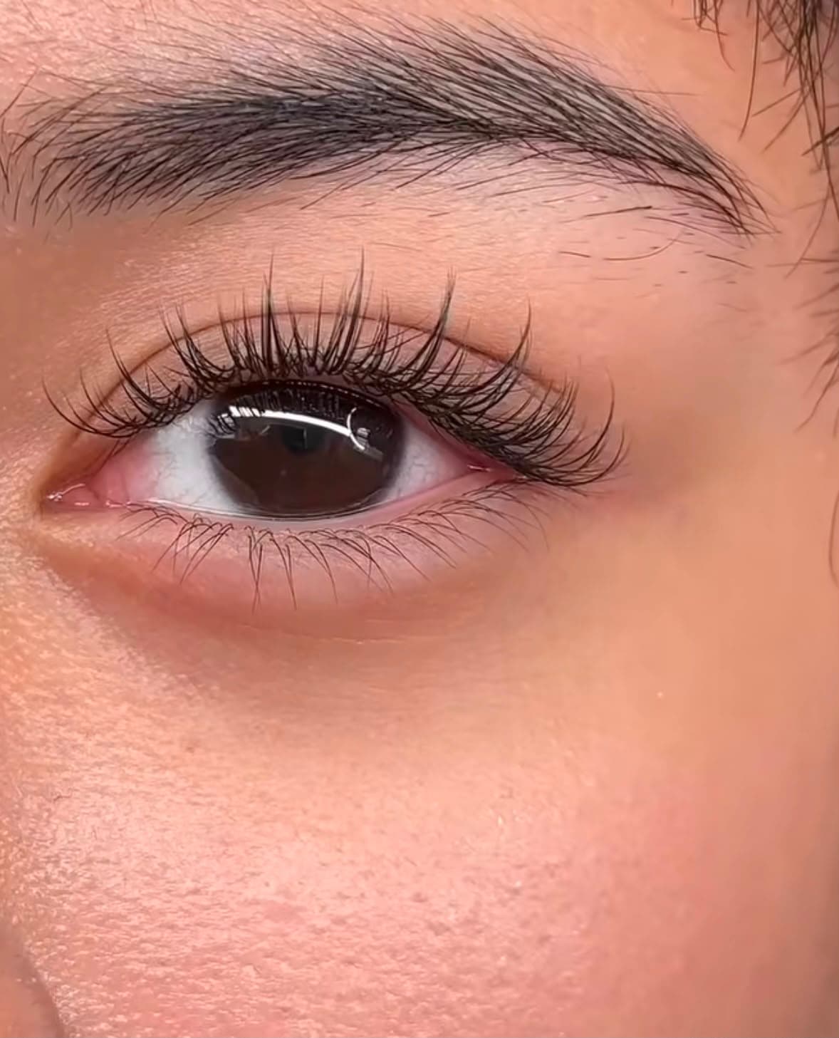 Close-up of an airy, defined eyelash extension set