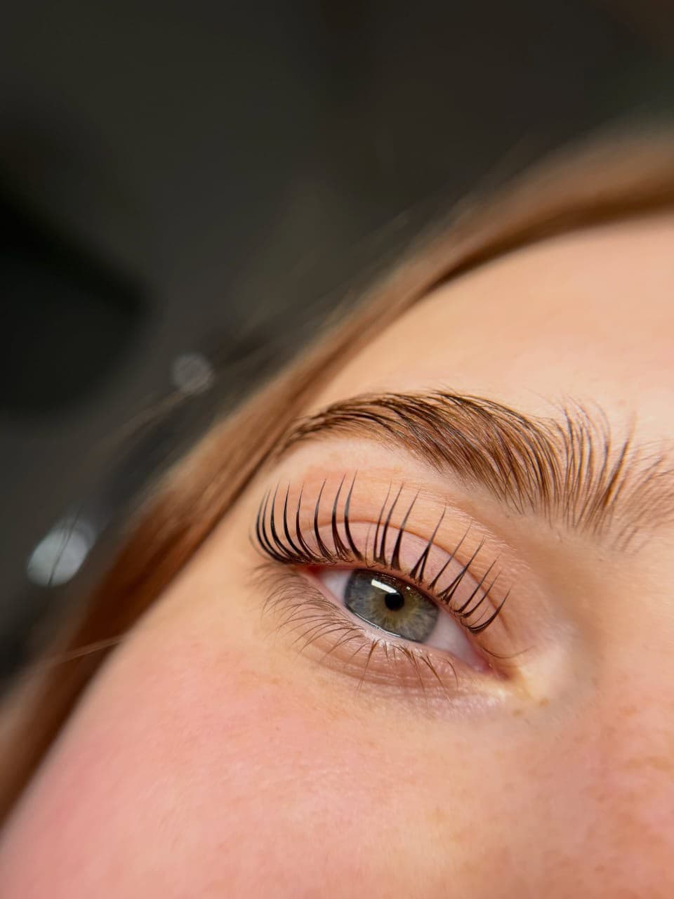 Side profile of a light, natural eyelash extension set